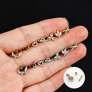 Detailed view of stainless steel screw back ear studs in gold and silver heart designs