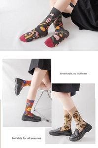 Detailed view of vintage cotton blend mid-tube socks with floral patterns and ribbed cuffs