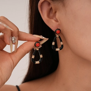 Retro triangle drop earrings with black enamel and red resin gem in gold plating