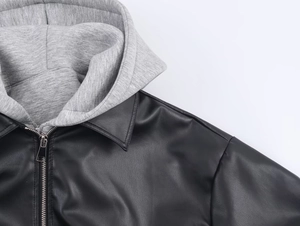 Detail of grey knit hood and black faux leather collar with premium metal zipper