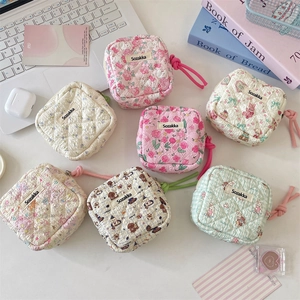 Quilted floral sanitary napkin storage bag with wristlet in various cute cartoon prints