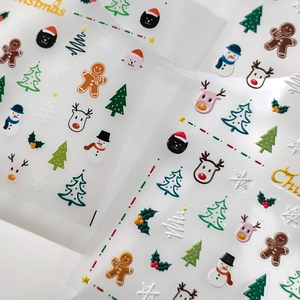 Christmas themed nail stickers featuring gingerbread man, reindeer and snowflake patterns