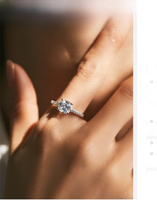 Macro shot of a S925 sterling silver cushion cut square diamond ring with pavé band