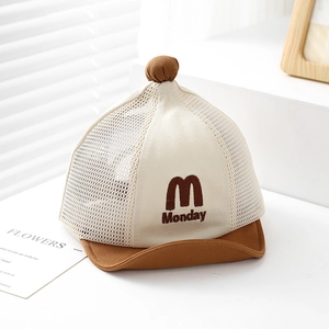 Detail of baby mesh cap featuring Monday embroidery and breathable net design