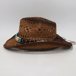Detailed view of the woven hollow pattern and ethnic beads on this brown cowboy straw hat