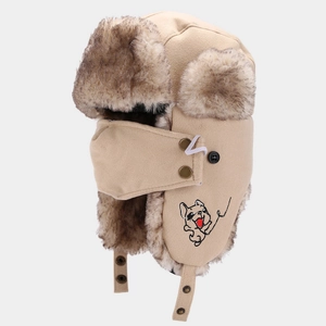 Detail of beige aviator hat featuring faux fur lining and French Bulldog embroidery