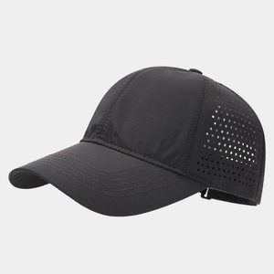 Detail of breathable laser-cut ventilation holes on a quick-dry black baseball cap