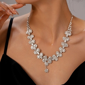 Silver sunflower layered necklace with sparkling rhinestones worn on a model's neck