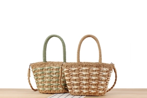 Macro detail of hand-woven straw tote bags with circular handles and shoulder straps