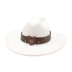 Close-up of white felt cowboy hat with rhinestone heart buckle and silver studs
