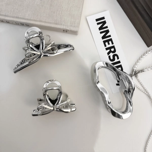 Three-piece set of silver metallic hair claws with bow and irregular wave designs