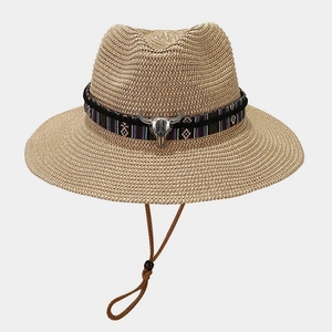 Straw Panama hat with bohemian tribal band and silver bull skull ornament in retro style