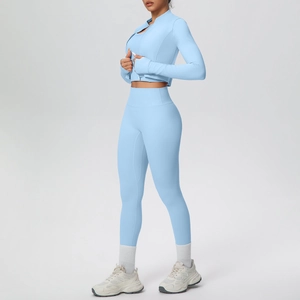 Close-up of light blue zip-up yoga jacket with thumbholes and high-waist leggings