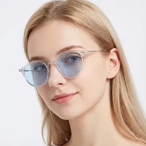 Retro round metal frame sunglasses with light blue lenses for a stylish minimalist look