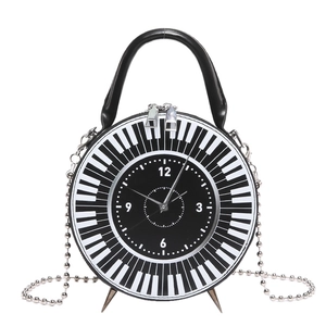 Creative round crossbody bag with clock face design and piano keyboard pattern detail