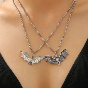 Gothic vintage bat pendant necklaces in silver finish on model for Halloween style