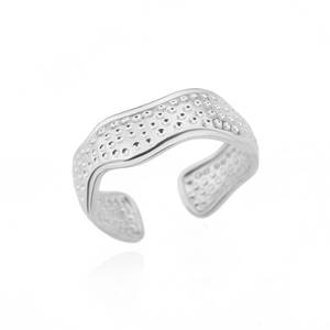 Close-up of a silver adjustable ring featuring a unique wave-like design with dot textures