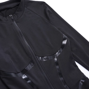 Detail of the high-shine piping and zipper on this black long sleeve athletic bodysuit