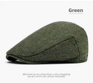 Detail of green herringbone tweed texture on classic British vintage flat cap