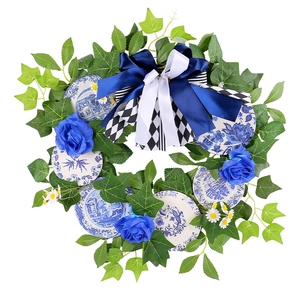 Blue rose wreath with green ivy leaves and porcelain pattern discs for door decoration