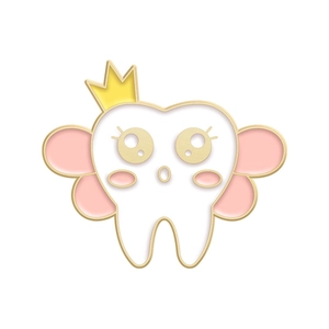 Close-up of cute enamel tooth pin with pink wings and golden crown decoration