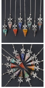 Detailed view of assorted crystal pendulums with silver crescent moon and star charms