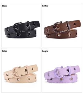 Detail view of four colors of slim grommet belts with punk style horseshoe buckles