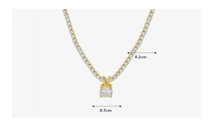 Detailed view of 18K gold plated tennis necklace with 0.2cm chain and 0.7cm zircon pendant