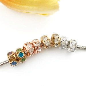 Polished large hole spacer beads with rhinestones in gold and silver finishes