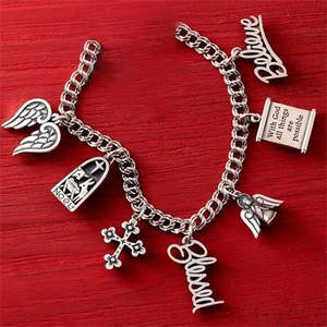 Detailed view of silver stainless steel charm bracelet with Noel and Blessed charms