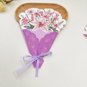 Detail of 3D Mother's Day card with pink lilies and purple ribbon tied in a bow