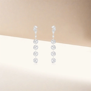 Detailed macro view of S925 sterling silver tassel earrings with tiered crystal drops