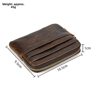 Detailed view of brown genuine leather wallet with card slots and bronze zipper hardware