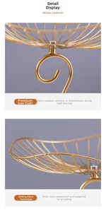 Detail of handcrafted welding and gold lacquer finish on a 3-tier metal fruit basket
