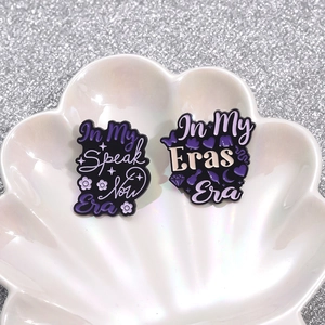 Purple enamel disco ball badges with In My Eras Era text on a seashell tray