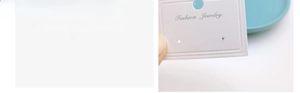 Macro view of white jewelry display card featuring embossed texture and hanging hook