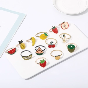 Set of fruit-shaped napkin rings featuring lemon, strawberry and pineapple designs
