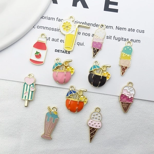 Detailed flat lay of colorful enamel ice cream and summer drink alloy charms for jewelry