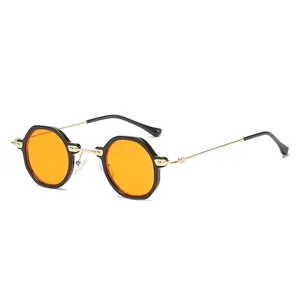 Occhiali da sole vintage piccoli rotondi con lenti arancioni e montatura nera stile steampunk