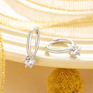 Elegant silver hoop earrings with a sparkling round zircon pendant and 6-prong setting