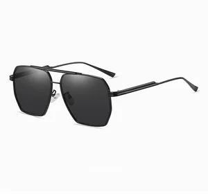 Detail view of black dual-bridge aviator sunglasses with polarized dark lenses