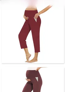 Detail of high-waist maternity leggings in wine red featuring side pocket stitching