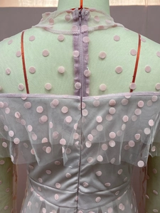 Detail of lavender tulle evening dress back with pink flocking dots and ruffle collar