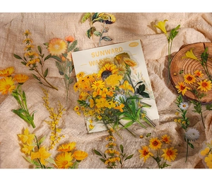 Detail view of 40PCS sunflower and daisy stickers on rustic burlap background