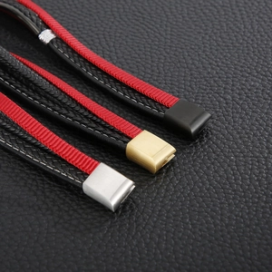 Detail of multi-layer woven leather bracelets with black, gold, and silver magnetic clasps