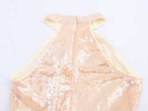 Detail of sequin halter neck evening dress featuring champagne gold sequins and zipper