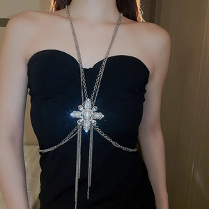 Detail of silver layered body chain with pearls and rhinestones on female model