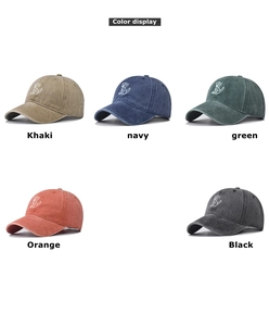 Color display of washed cotton baseball caps with minimalist dog embroidery in five shades