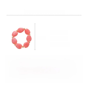 Detail shot of pink marble acrylic oval bead bracelet with gold metal spacers