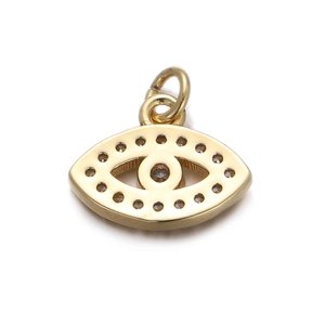 Detailed view of evil eye charm with gold finish, zircon inlay, and top connector ring